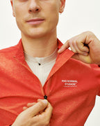 Mechanism Stow Away Jacket - AOP Hibiscus Orange